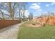Green backyard featuring a firepit, new lawn, and wood fence at 1210 S State Ave, Indianapolis, IN 46203