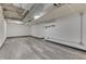 Finished basement area with sleek wood-look flooring offers a versatile space at 1210 S State Ave, Indianapolis, IN 46203