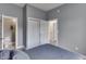 Comfortable bedroom with gray walls, showing the closet and entry to an ensuite bathroom at 1210 S State Ave, Indianapolis, IN 46203