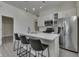 Well-equipped kitchen with white cabinets, stainless steel appliances, and a spacious island for seating and food prep at 1210 S State Ave, Indianapolis, IN 46203
