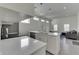 Bright, white kitchen with an island, modern appliances, and an open layout that connects to the living area at 1210 S State Ave, Indianapolis, IN 46203