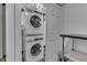 A stacked Electrolux washer and dryer in the basement provide space-saving convenience for laundry needs at 1210 S State Ave, Indianapolis, IN 46203