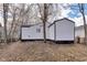 This yard has bare trees and a white exterior at 1254 Mcdougal St, Indianapolis, IN 46203