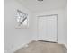 An updated bedroom with neutral carpet and a double door closet at 1254 Mcdougal St, Indianapolis, IN 46203