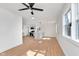 Open living room featuring modern lighting, light wood flooring, and an open concept kitchen at 1254 Mcdougal St, Indianapolis, IN 46203