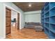 Finished basement featuring ample storage, a comfortable sofa, and stylish barn doors leading to adjacent room at 12777 Rotterdam Rd, Fishers, IN 46037