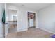 Bedroom featuring an open door leading to a closet and another door leading to the hallway with spindled railing at 12777 Rotterdam Rd, Fishers, IN 46037