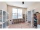 Versatile room with natural light, storage shelves, and french doors leading to another room at 12777 Rotterdam Rd, Fishers, IN 46037