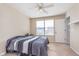 Cozy bedroom with a ceiling fan, window, and neutral carpet at 12777 Rotterdam Rd, Fishers, IN 46037