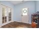 Bright entryway with stylish wood floors, glass panel doors, and a convenient shoe rack at 12777 Rotterdam Rd, Fishers, IN 46037