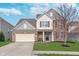 Charming two-story home featuring brick accents, well-manicured lawn, and inviting front porch perfect for relaxation at 12777 Rotterdam Rd, Fishers, IN 46037
