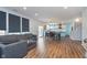 Open living area with views of the kitchen and dining area, featuring modern blue cabinets and a stylish living space at 12777 Rotterdam Rd, Fishers, IN 46037
