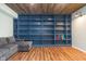 Basement shelving offers ample storage and display, complemented by a comfortable sitting area, perfect for organization at 12777 Rotterdam Rd, Fishers, IN 46037