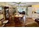 Inviting dining area featuring hardwood floors, a ceiling fan, and an open flow at 1408 Lawrence Way, Anderson, IN 46013