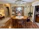 Dining area showcasing hardwood floors and an open layout with a view to the patio door at 1408 Lawrence Way, Anderson, IN 46013
