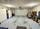 View of the two car garage with storage cabinets at 1408 Lawrence Way, Anderson, IN 46013