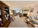 Spacious living room with fireplace and plush furnishings, with view into dining area at 1408 Lawrence Way, Anderson, IN 46013