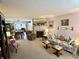 Bright living room with fireplace, plush seating, and seamless transition to dining area at 1408 Lawrence Way, Anderson, IN 46013