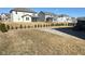 Large backyard with a paved patio, lush grass, and a row of trees at 15408 Brown Jack Dr, Fishers, IN 46040