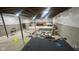 Unfinished basement with concrete walls, exposed beams, and storage at 15408 Brown Jack Dr, Fishers, IN 46040