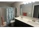 Clean bathroom features double vanity with quartz countertop and a tub and shower combo at 15408 Brown Jack Dr, Fishers, IN 46040