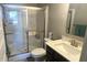 A full bathroom with a glass enclosed shower, a sink, and a toilet at 15408 Brown Jack Dr, Fishers, IN 46040
