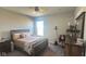 This primary bedroom features a ceiling fan and window for natural light at 15408 Brown Jack Dr, Fishers, IN 46040