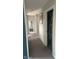 Clean hallway with neutral paint, carpet, and doors leading to other rooms at 15408 Brown Jack Dr, Fishers, IN 46040