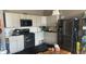 A kitchen features stainless steel appliances, light gray cabinets, and granite countertops at 15408 Brown Jack Dr, Fishers, IN 46040