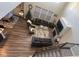 Spacious living room with soaring ceilings, hardwood floors, large windows, fireplace, and comfortable seating at 15408 Brown Jack Dr, Fishers, IN 46040