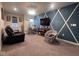 Comfortable living room showcasing a wall design with a hanging chair and ample seating at 15408 Brown Jack Dr, Fishers, IN 46040