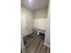 Mud room with storage bench with white wainscotting and hooks for coats at 15408 Brown Jack Dr, Fishers, IN 46040
