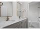Double vanity bathroom with bronze fixtures and a shower/tub combo at 1668 Carrollton Rail Dr, Westfield, IN 46074