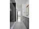 Modern bathroom with a sleek glass shower, double vanity, and neutral color palette at 1668 Carrollton Rail Dr, Westfield, IN 46074