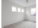 Bright bedroom with three large windows providing ample natural light and light gray carpet at 1668 Carrollton Rail Dr, Westfield, IN 46074