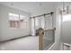 Open bonus room with natural light, neutral carpet and modern chandelier at 1668 Carrollton Rail Dr, Westfield, IN 46074