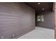 Exterior view of a covered patio area with wood-like siding and concrete flooring at 1668 Carrollton Rail Dr, Westfield, IN 46074