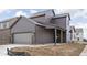 Exterior elevation of a two-story house featuring a side-entry garage and a covered porch at 1668 Carrollton Rail Dr, Westfield, IN 46074