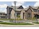 Beautiful new construction home featuring modern architecture, brick accents, and professional landscaping at 1668 Carrollton Rail Dr, Westfield, IN 46074