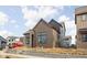 Modern two-story home featuring brick, vertical wood paneling, and professional landscaping under construction at 1668 Carrollton Rail Dr, Westfield, IN 46074