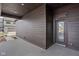 Covered brown siding patio area with an entrance to the house at 1668 Carrollton Rail Dr, Westfield, IN 46074
