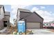 New two-story home featuring a modern garage, neutral-colored siding, and professional landscaping at 1668 Carrollton Rail Dr, Westfield, IN 46074