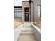 Close up of new construction home showing entry way and stone steps leading to front door at 1668 Carrollton Rail Dr, Westfield, IN 46074
