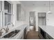 New kitchen featuring an island, white countertops, and stainless steel appliances and fixtures at 1668 Carrollton Rail Dr, Westfield, IN 46074