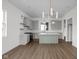 Spacious kitchen features an island, a modern light fixture, and ample cabinet storage at 1668 Carrollton Rail Dr, Westfield, IN 46074
