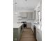 Bright kitchen with grey cabinets, stainless steel appliances, and a center island with white countertops at 1668 Carrollton Rail Dr, Westfield, IN 46074