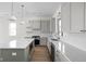Modern kitchen featuring a large island, stylish cabinetry, and stainless steel appliances at 1668 Carrollton Rail Dr, Westfield, IN 46074