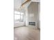 Bright, open living room with hardwood floors, fireplace with accent wall, and a modern chandelier at 1668 Carrollton Rail Dr, Westfield, IN 46074