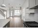Bright, open floor plan showcasing the kitchen, dining, and living areas with modern finishes at 1668 Carrollton Rail Dr, Westfield, IN 46074