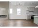 Open-concept living room showcasing a modern fireplace with accent wall and a gourmet kitchen at 1668 Carrollton Rail Dr, Westfield, IN 46074